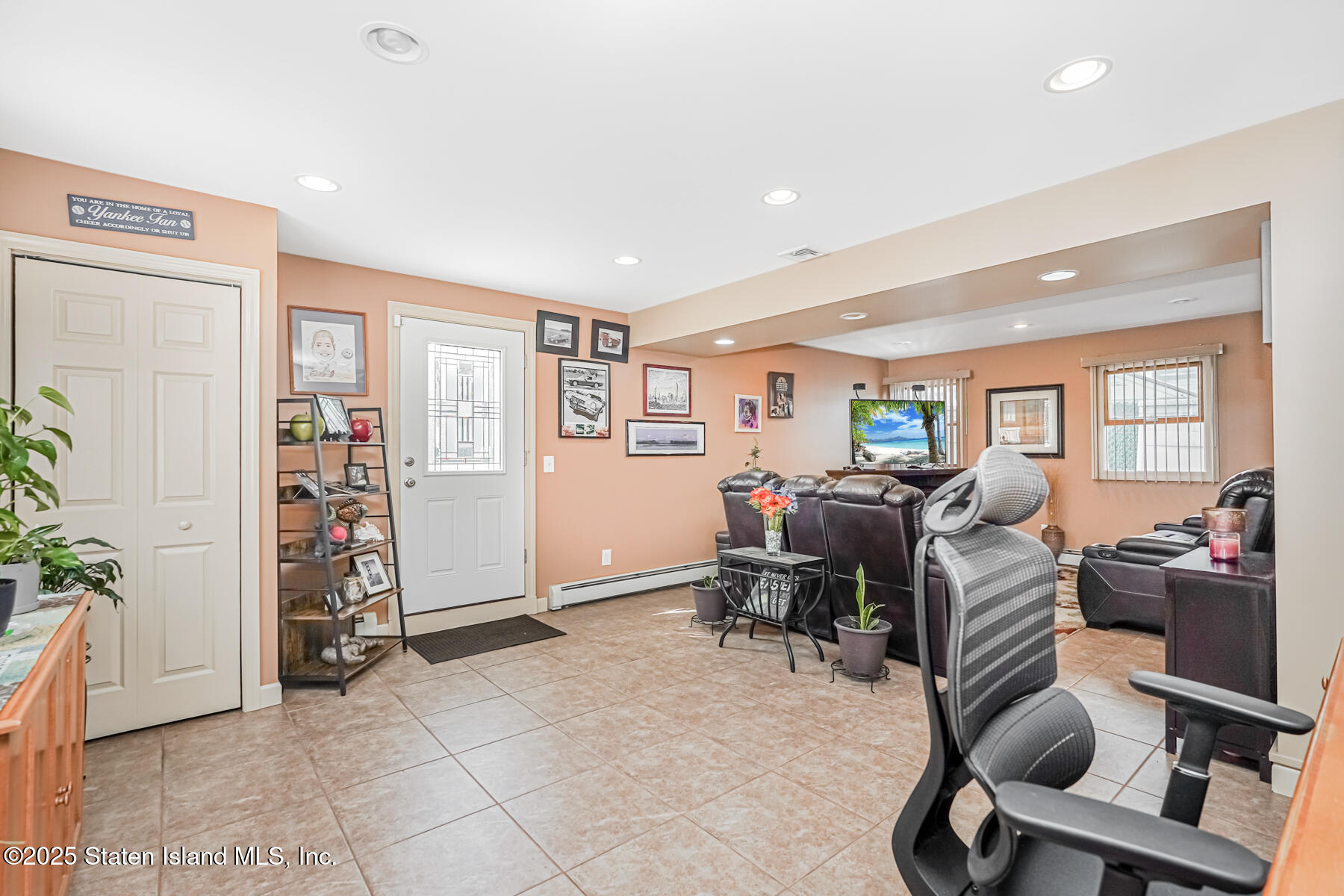 149 Rensselaer Avenue Staten Island, NY 10312 - Photo 4 of 33 a view of a livingroom with workspace and a window