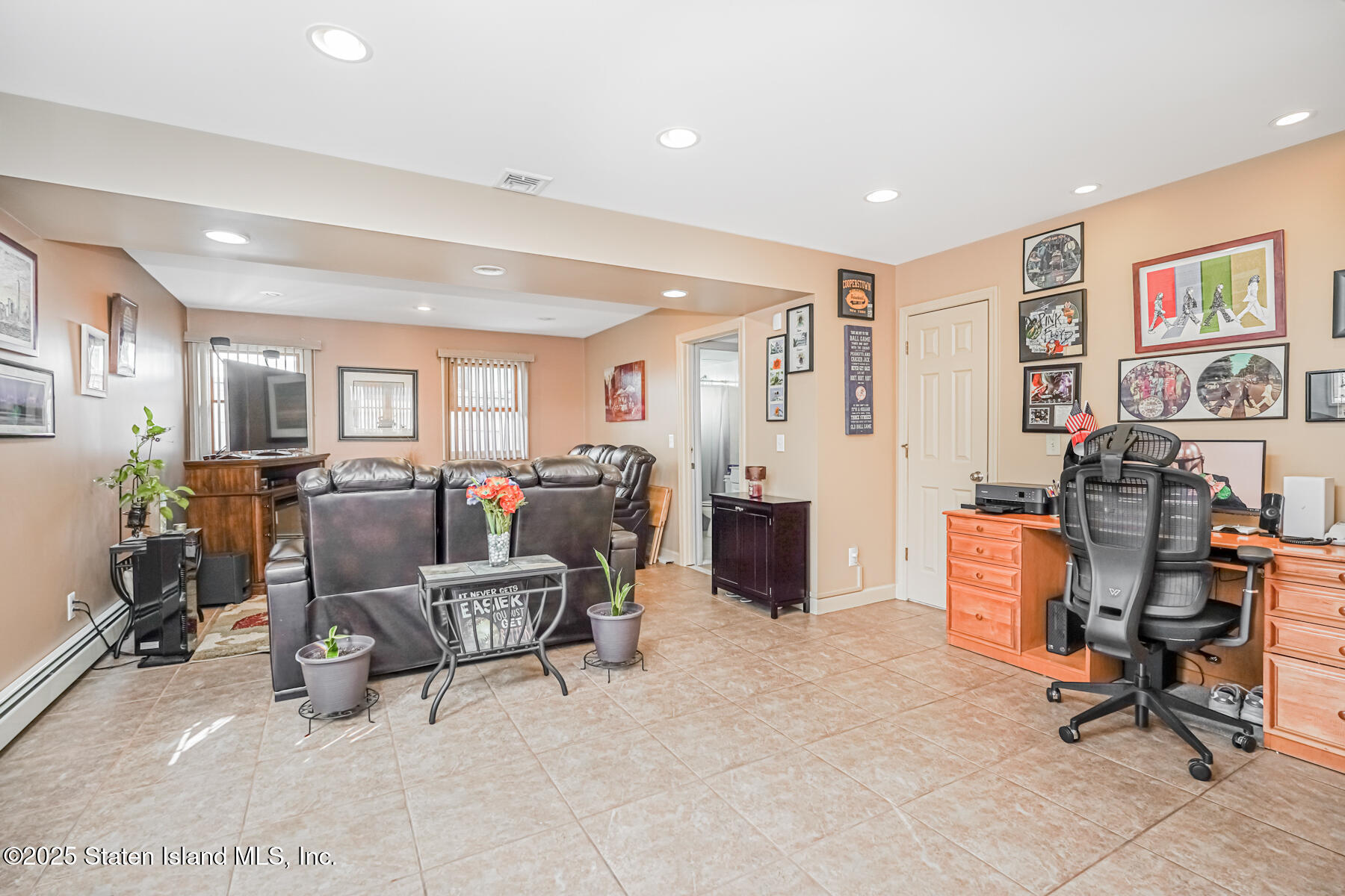 149 Rensselaer Avenue Staten Island, NY 10312 - Photo 5 of 33 a view of a livingroom with workspace and a couch