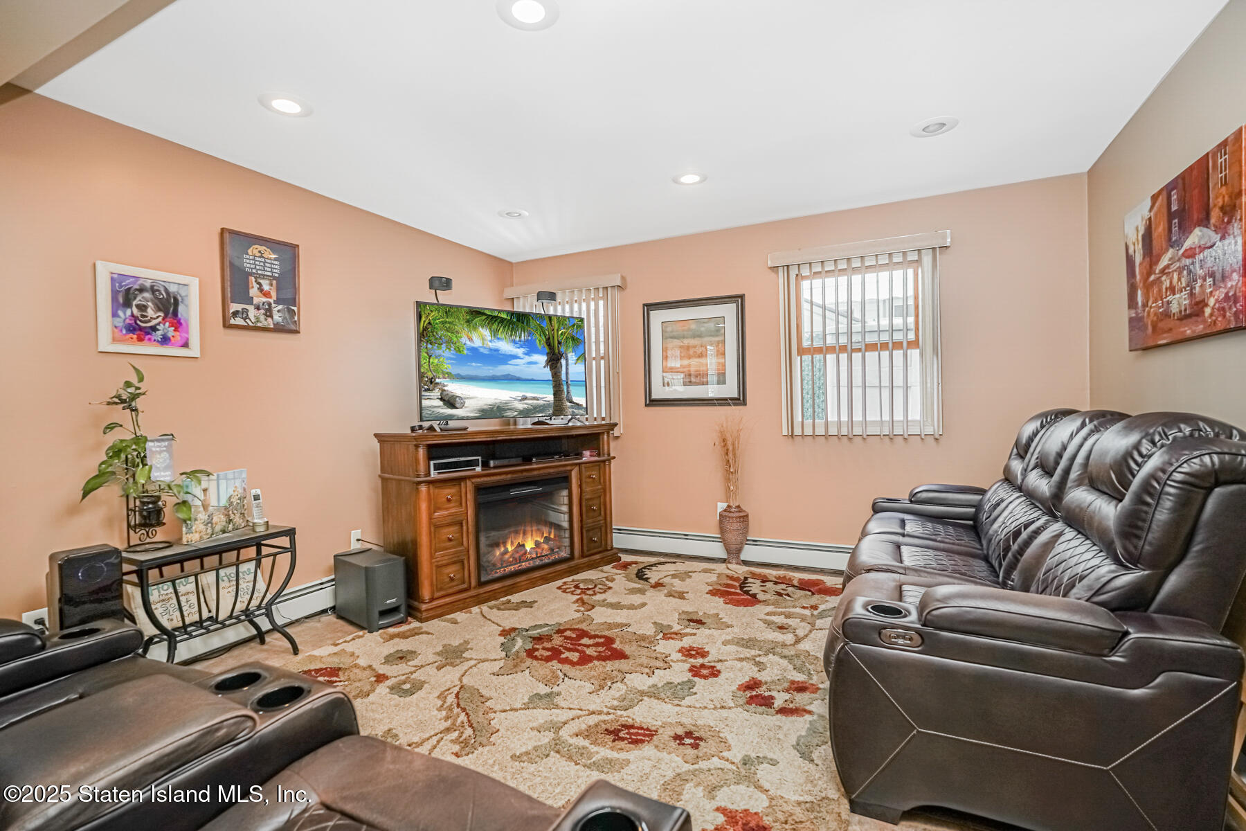 149 Rensselaer Avenue Staten Island, NY 10312 - Photo 7 of 33 a living room with furniture and a flat screen tv