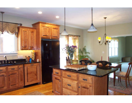 24 Spring Street Hopkinton, MA 01748 - Photo 3 of 10 a kitchen with granite countertop a sink cabinets and wooden floor