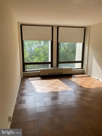 a view of empty room with large window
