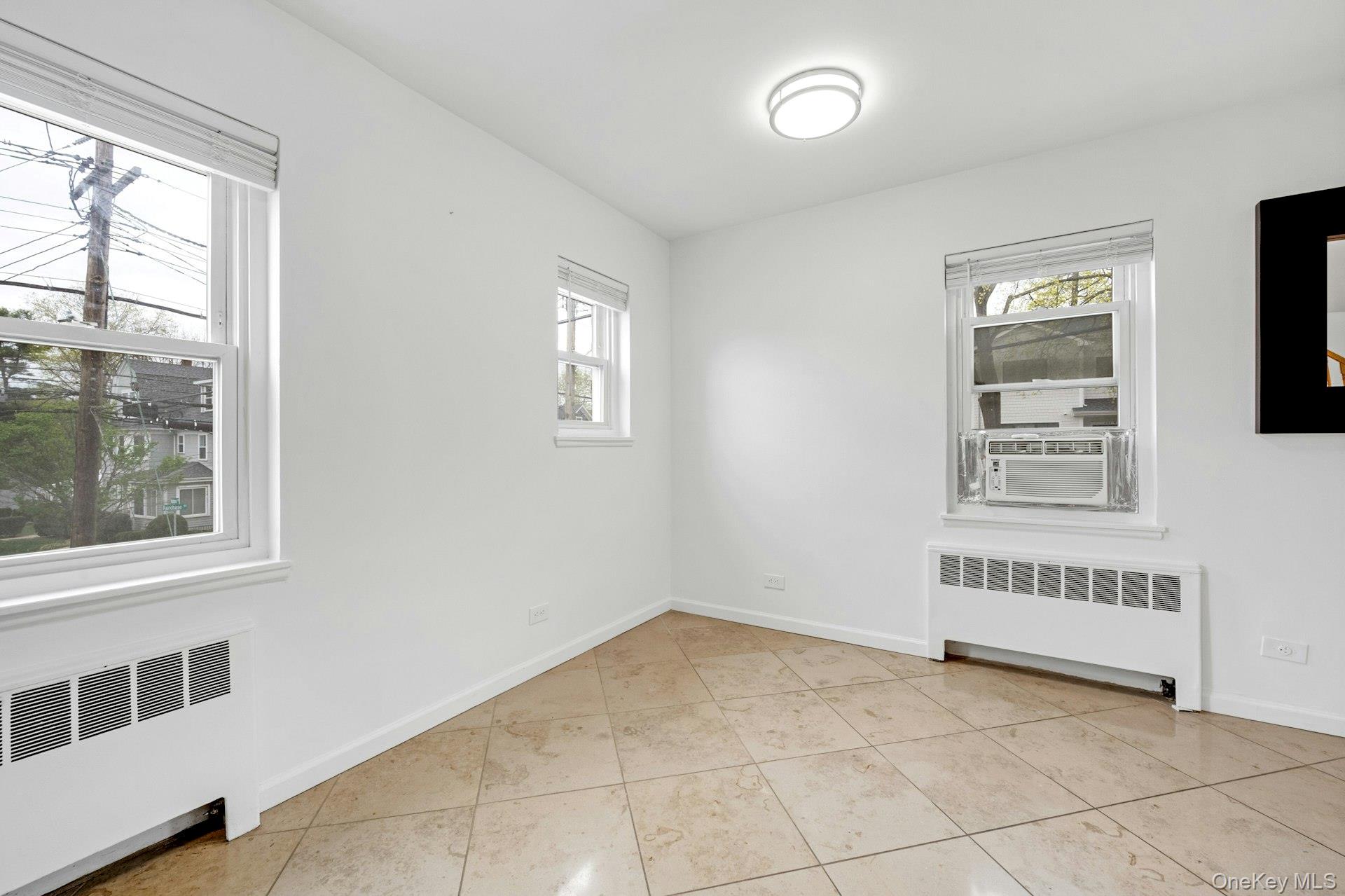 184 Purchase Street, Unit 12 Rye, NY 10580 - Photo 16 of 33 a view of an empty room with a window