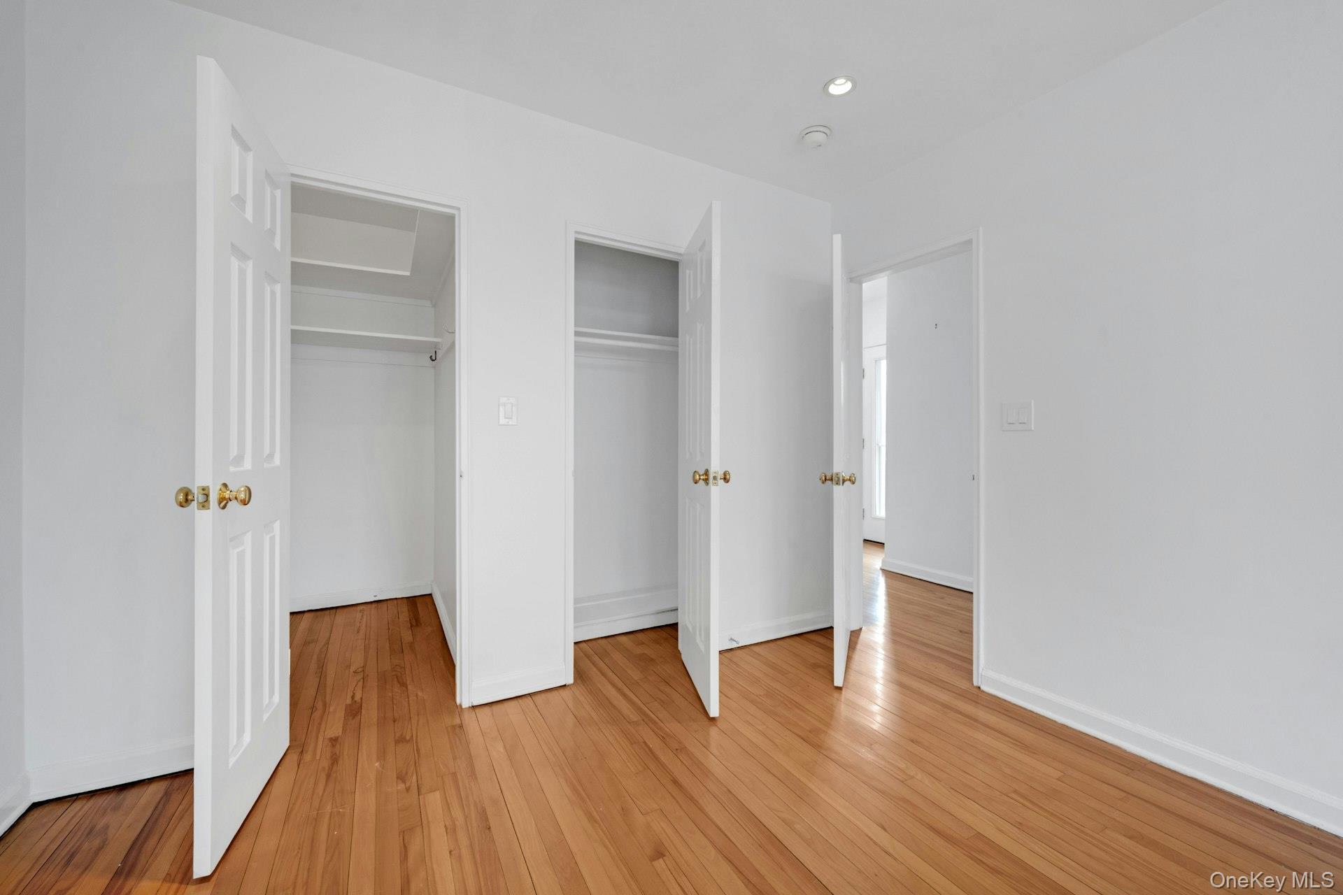 184 Purchase Street, Unit 12 Rye, NY 10580 - Photo 19 of 33 a view of room with wooden floor and window