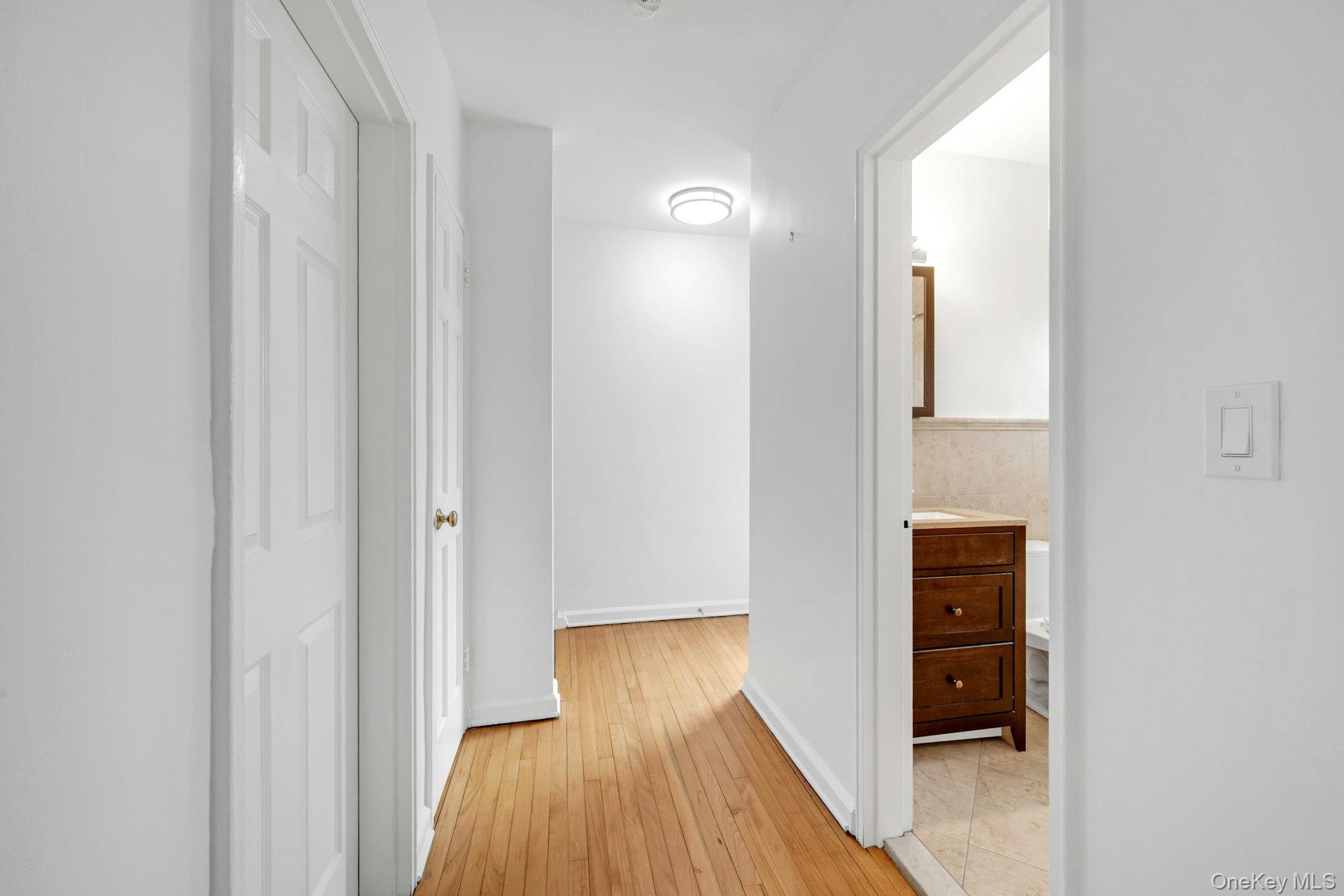 184 Purchase Street, Unit 12 Rye, NY 10580 - Photo 23 of 33 a view of a hallway with wooden floor