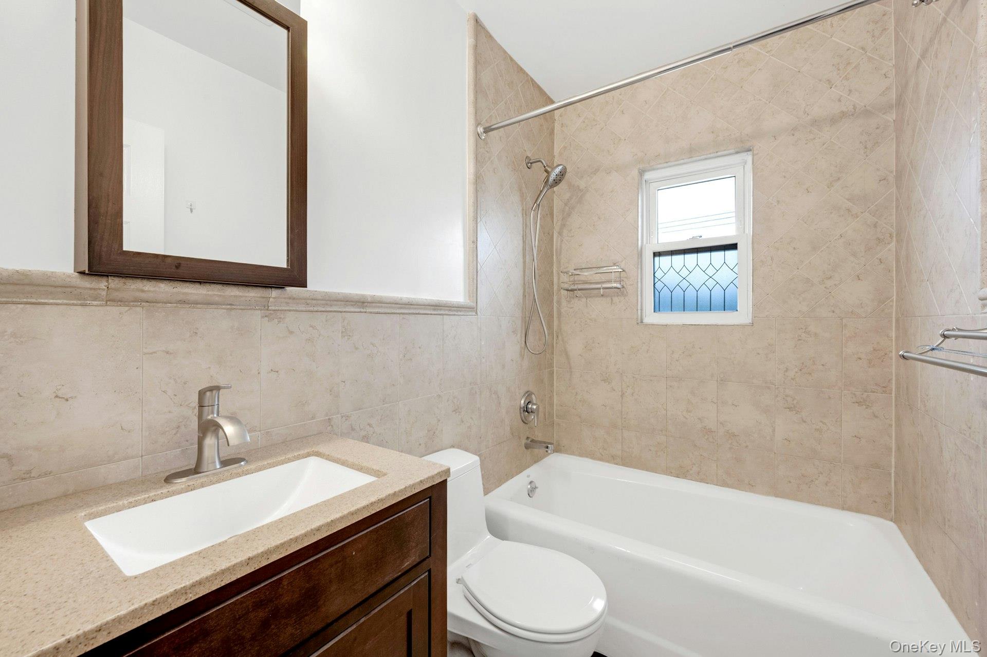 184 Purchase Street, Unit 12 Rye, NY 10580 - Photo 24 of 33 a bathroom with a sink a toilet and shower