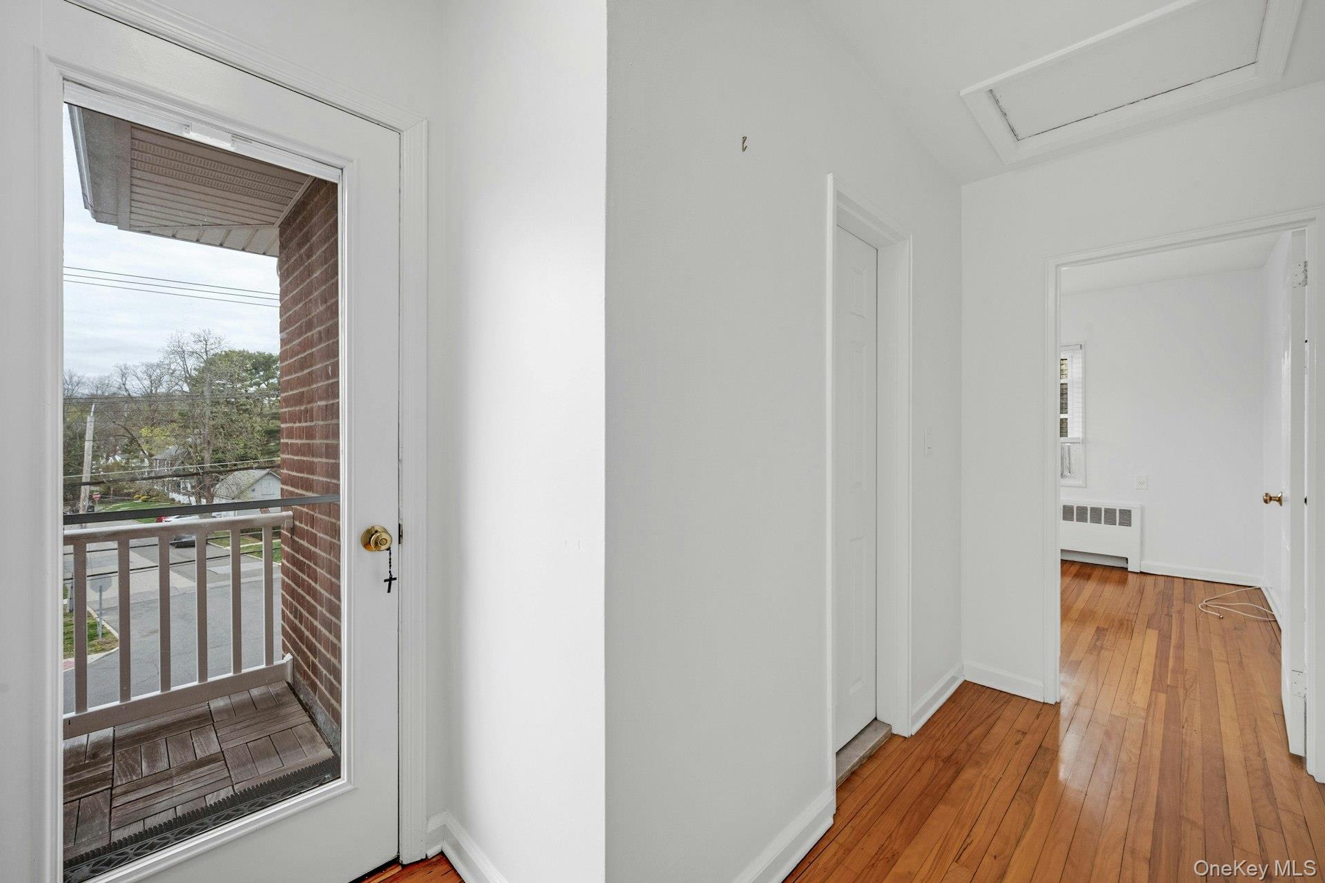 184 Purchase Street, Unit 12 Rye, NY 10580 - Photo 25 of 33 a view of a room with wooden floor and door