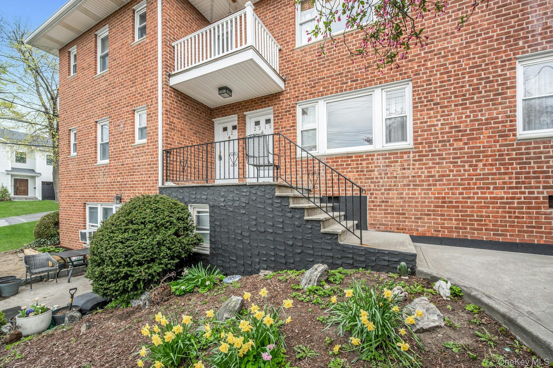 184 Purchase Street, Unit 12 Rye, NY 10580 - Photo 3 of 33 a brick building with a yard