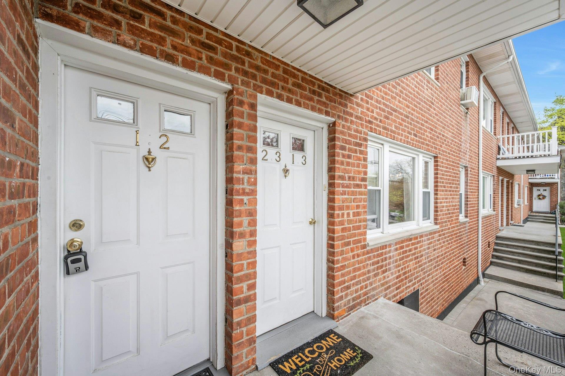 184 Purchase Street, Unit 12 Rye, NY 10580 - Photo 31 of 33 a view of a brick house with many windows