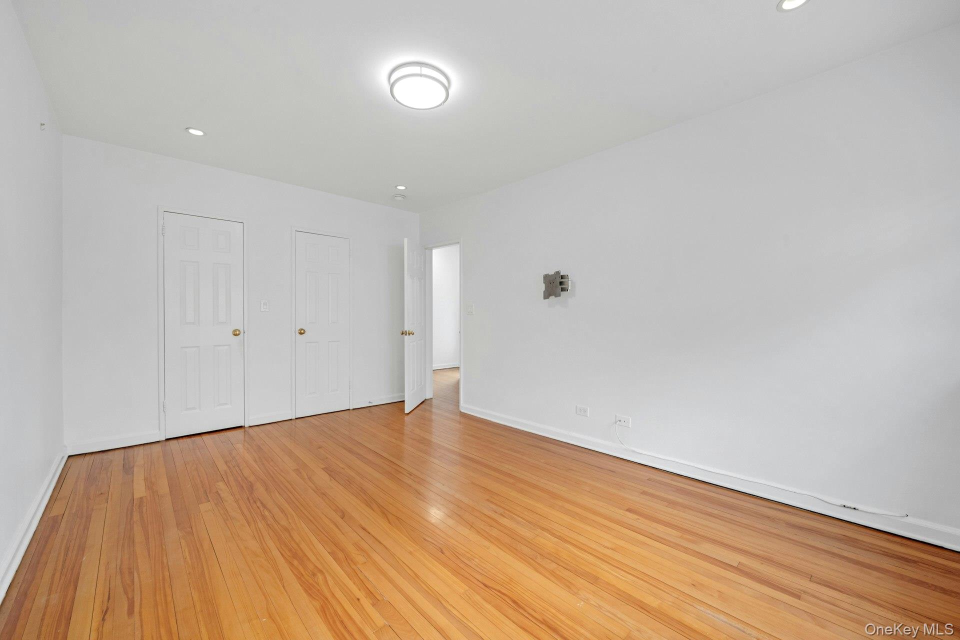 184 Purchase Street, Unit 12 Rye, NY 10580 - Photo 32 of 33 a view of an empty room with wooden floor