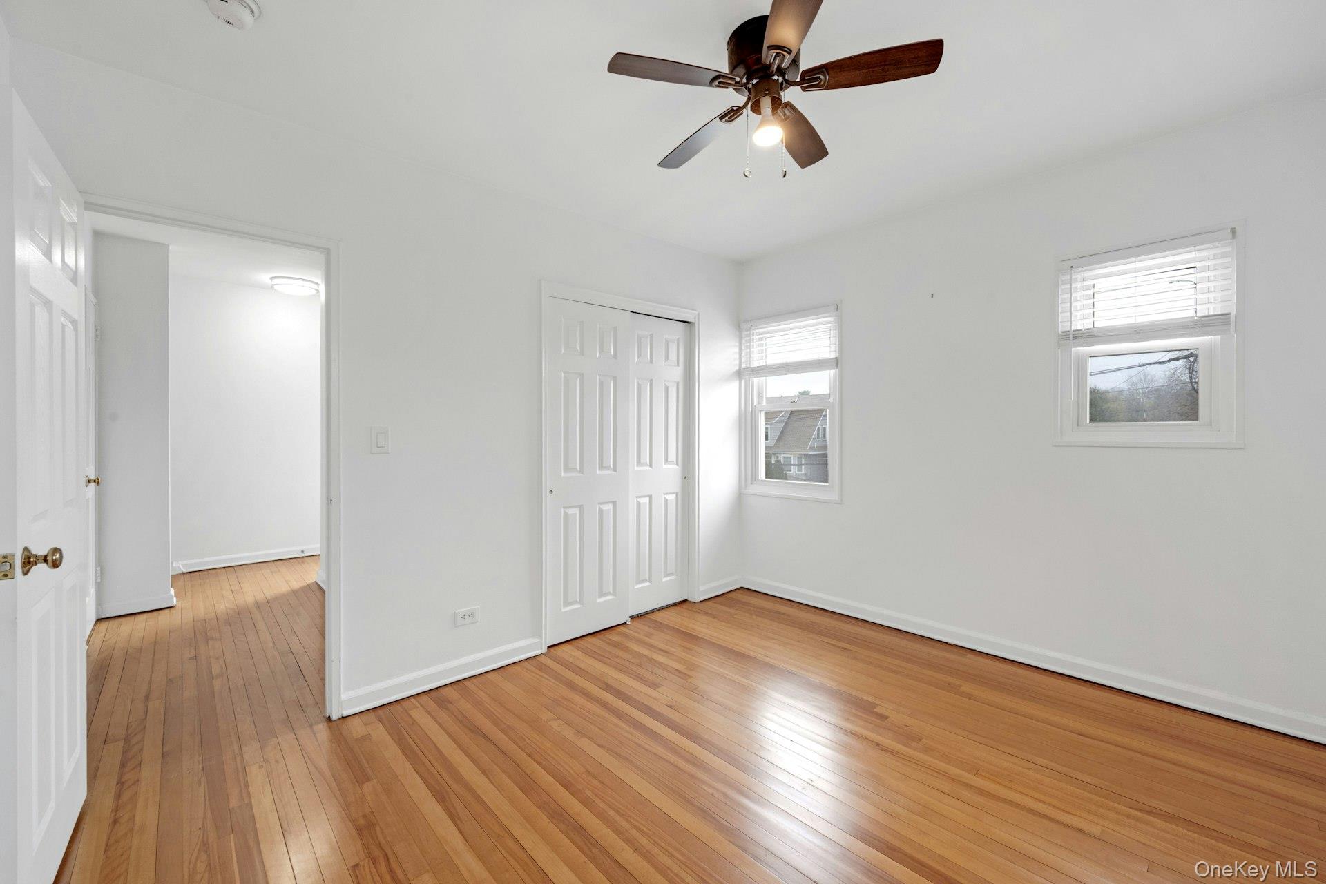184 Purchase Street, Unit 12 Rye, NY 10580 - Photo 33 of 33 a view of empty room with wooden floor and fan