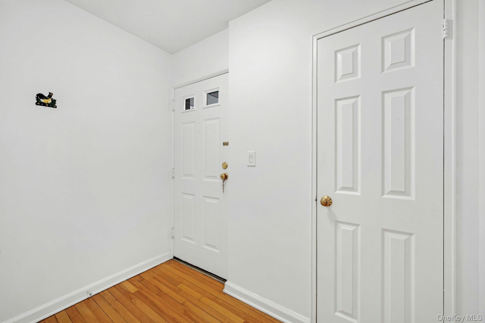 184 Purchase Street, Unit 12 Rye, NY 10580 - Photo 5 of 33 a view of a room with wooden floor