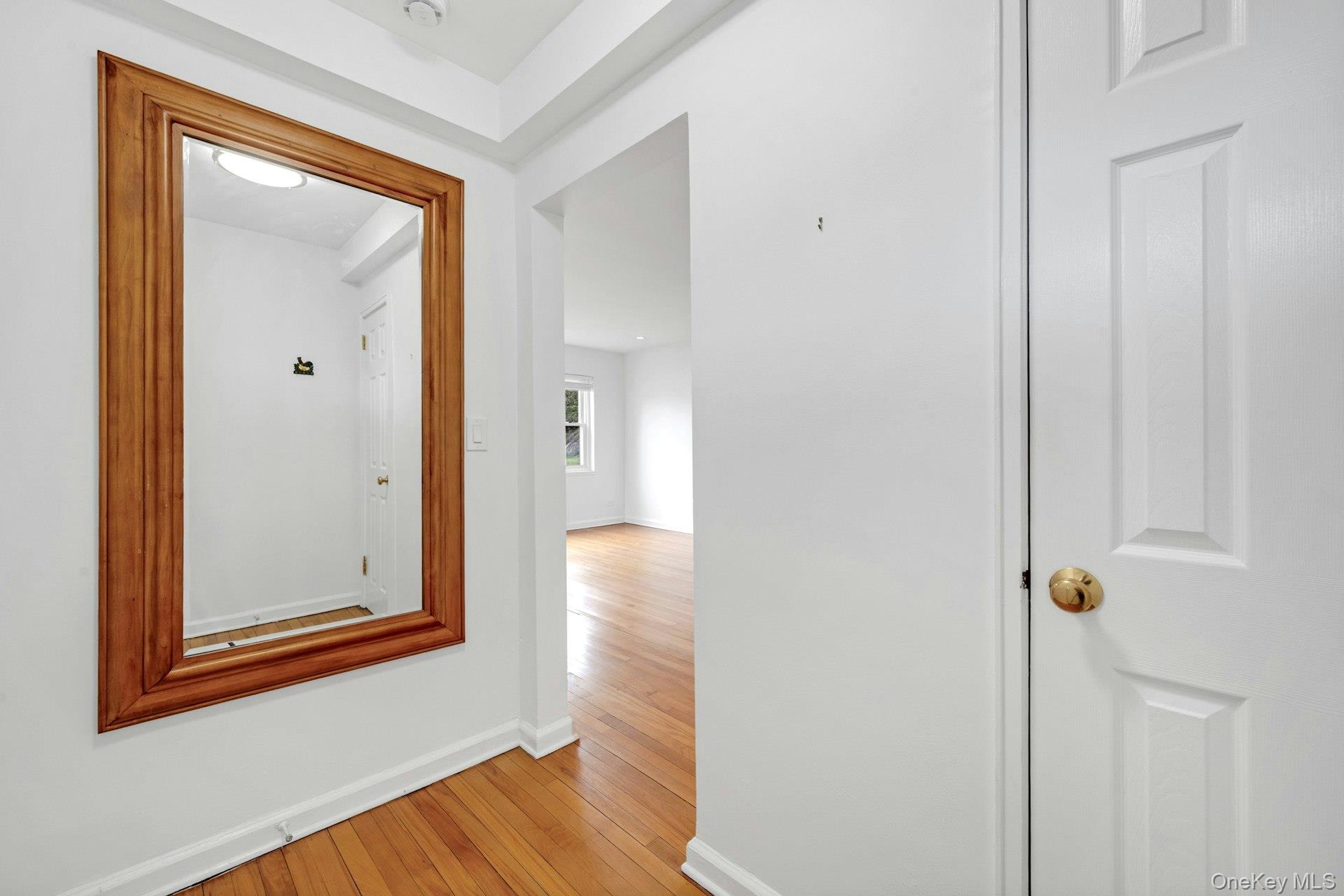 184 Purchase Street, Unit 12 Rye, NY 10580 - Photo 7 of 33 a view of a hallway with wooden floor