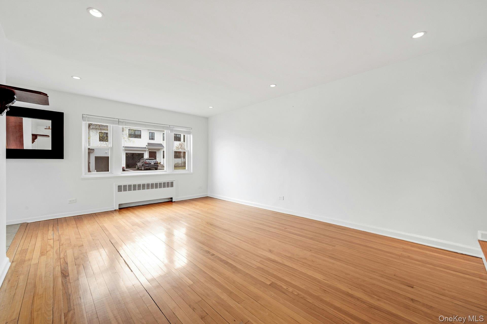 184 Purchase Street, Unit 12 Rye, NY 10580 - Photo 8 of 33 a view of empty room with wooden floor and fan