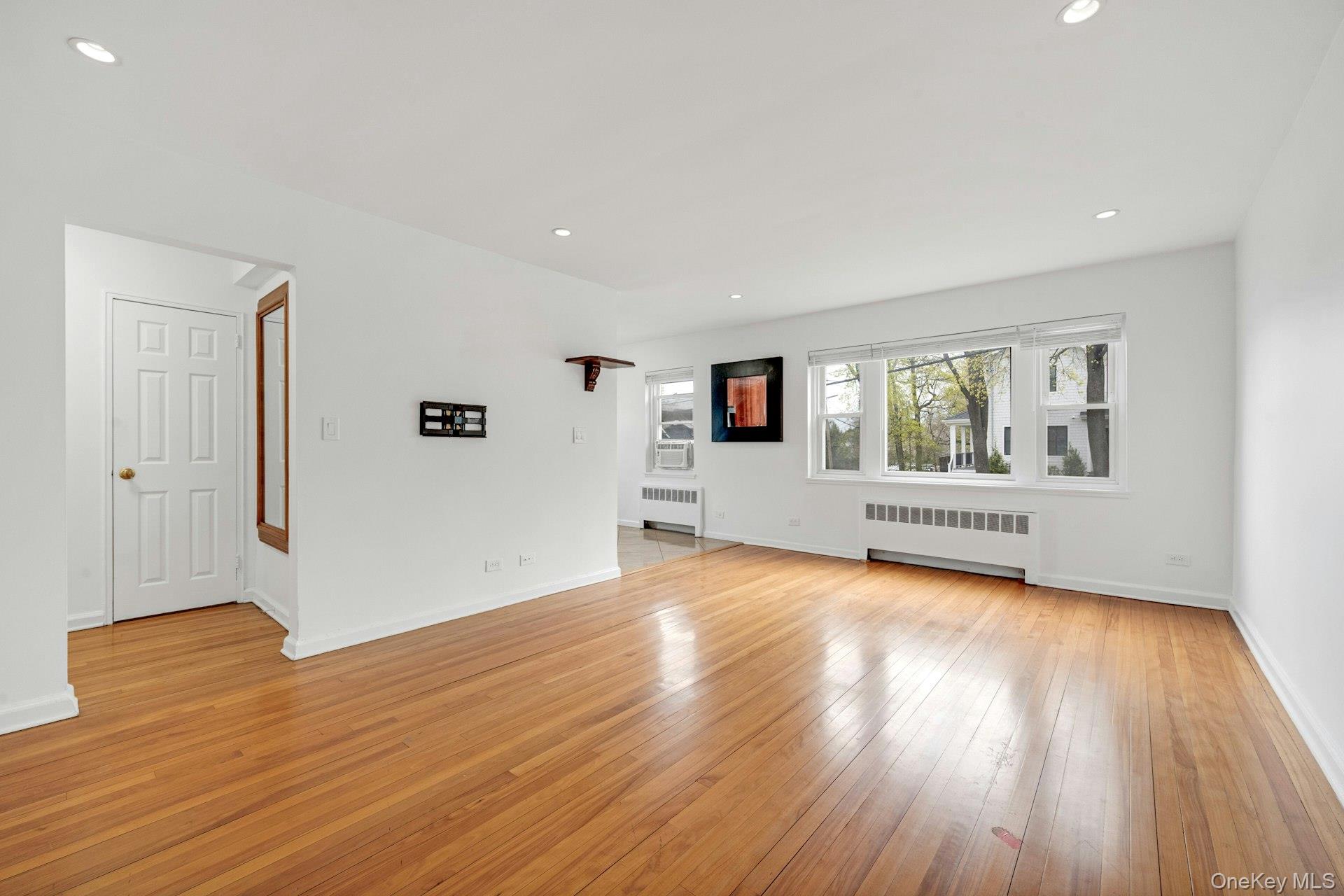 184 Purchase Street, Unit 12 Rye, NY 10580 - Photo 9 of 33 a view of a room with wooden floor and windows