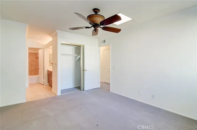 a view of empty room with ceiling fan