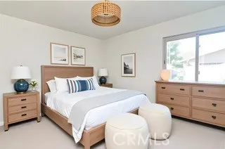 a bed room with a bed and a window