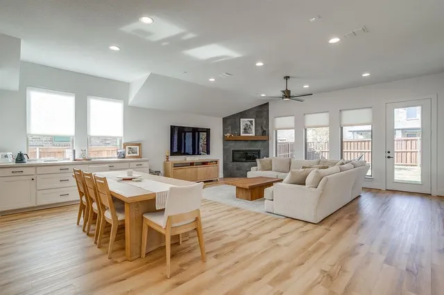 a view of a dining room with furniture window and wooden floor