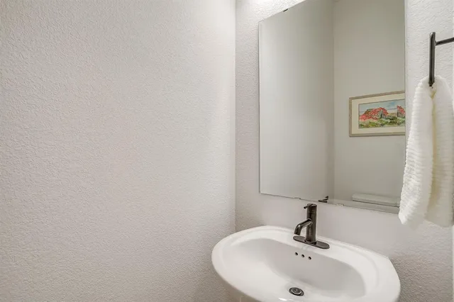 a room with a chair and a cabinet in it