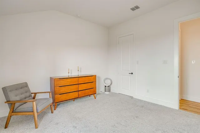 a view of a livingroom with chairs