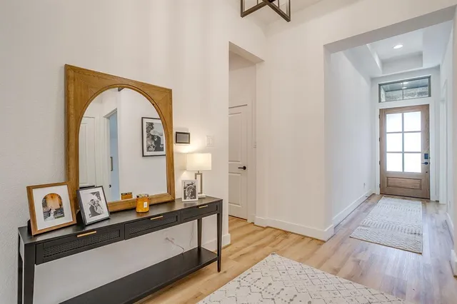 a view of room with window and wooden floor