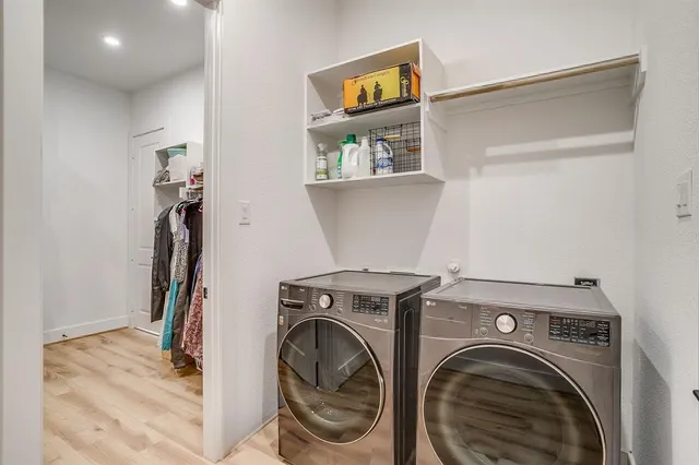 a view of a chair and table in the back yard