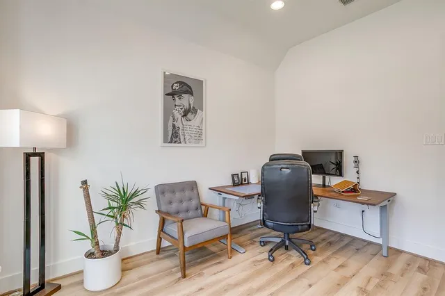 a workspace with furniture and a lamp