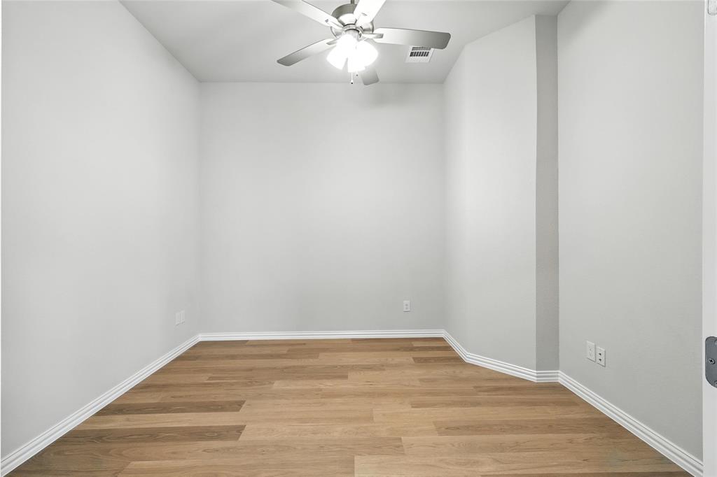 530 Red Barn Drive Van Alstyne, TX 75495 - Photo 23 of 40 Empty room with a ceiling fan and light wood-style flooring