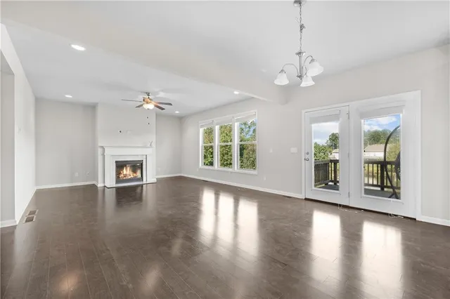 a kitchen with stainless steel appliances granite countertop a sink and a stove