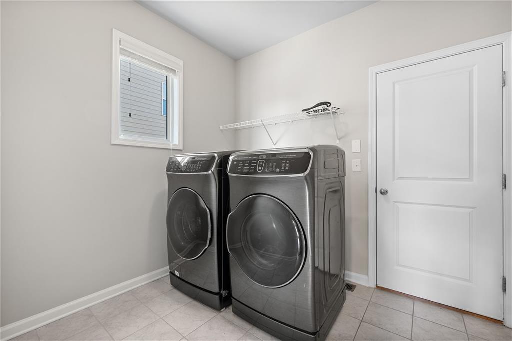 2375 Matlin Way Buford, GA 30519 - Photo 17 of 58 a utility room with dryer and washer