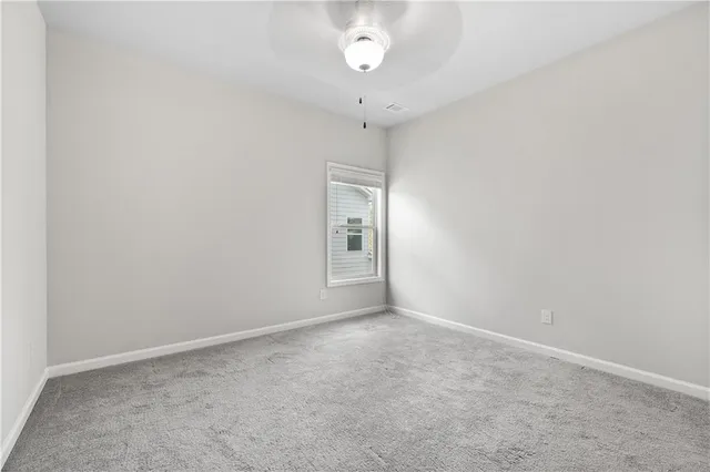 a bathroom with a granite countertop sink a toilet and bathtub