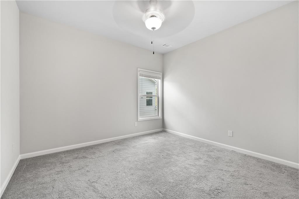 2375 Matlin Way Buford, GA 30519 - Photo 20 of 58 a view of an empty room with a window