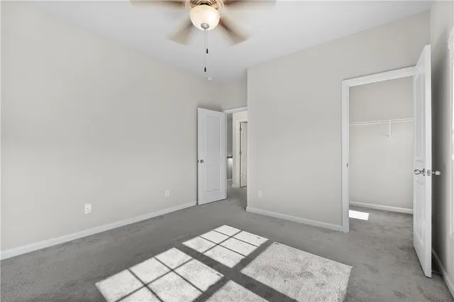 a white bath tub sitting next to a white toilet