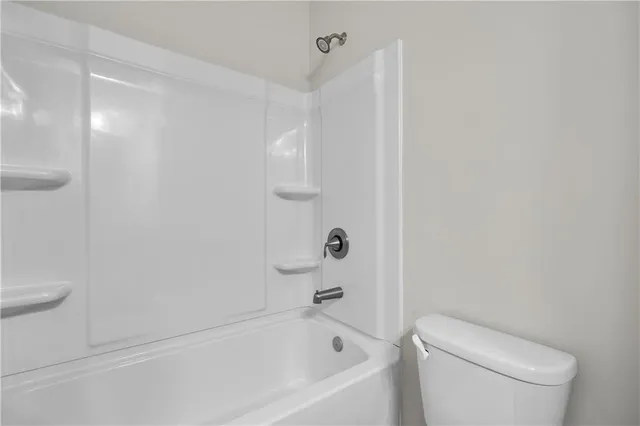 an empty room with a empty space and windows