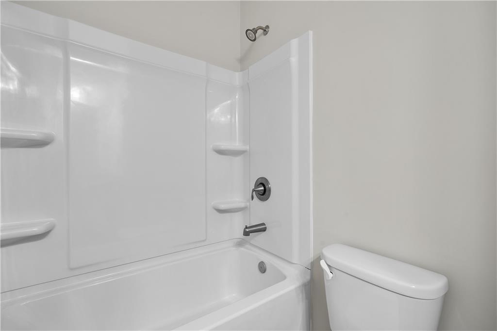 2375 Matlin Way Buford, GA 30519 - Photo 24 of 58 a white bath tub sitting next to a white toilet