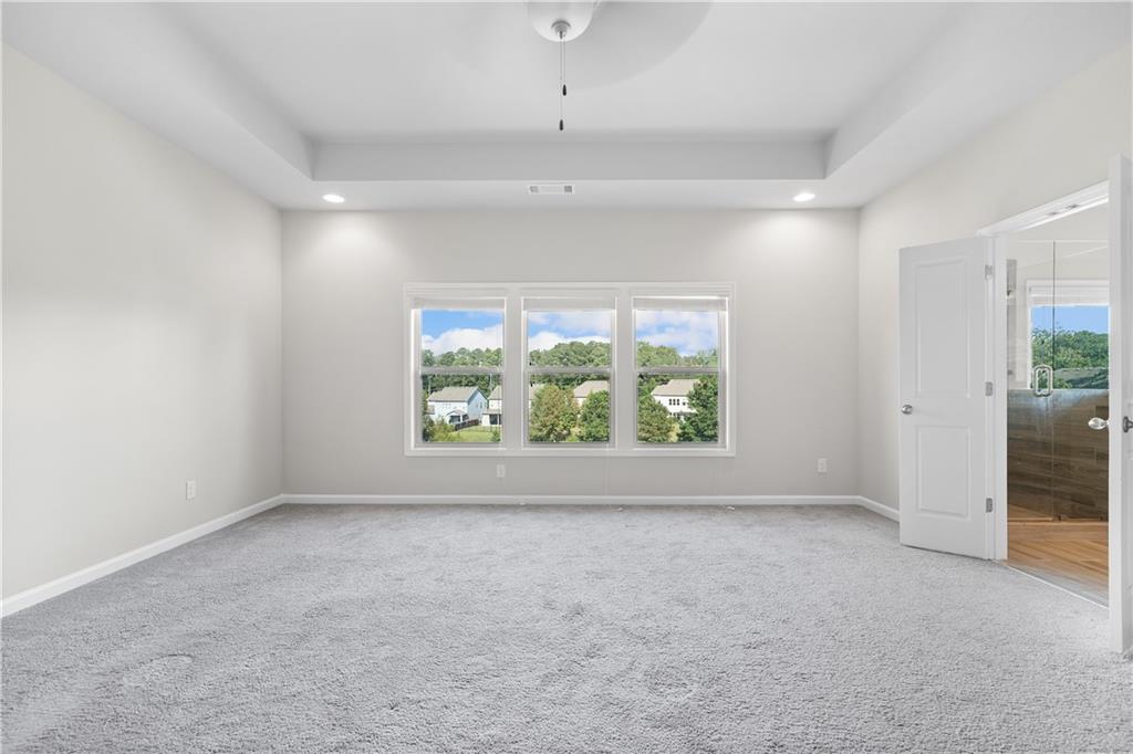 2375 Matlin Way Buford, GA 30519 - Photo 31 of 58 an empty room with windows and outdoor view