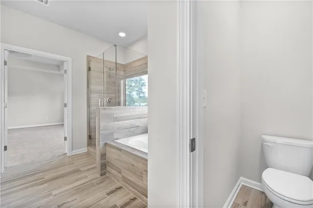 a view of entryway with wooden floor and stairs