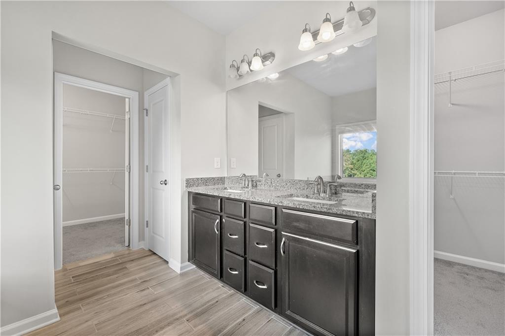 2375 Matlin Way Buford, GA 30519 - Photo 35 of 58 a bathroom with a sink and a mirror