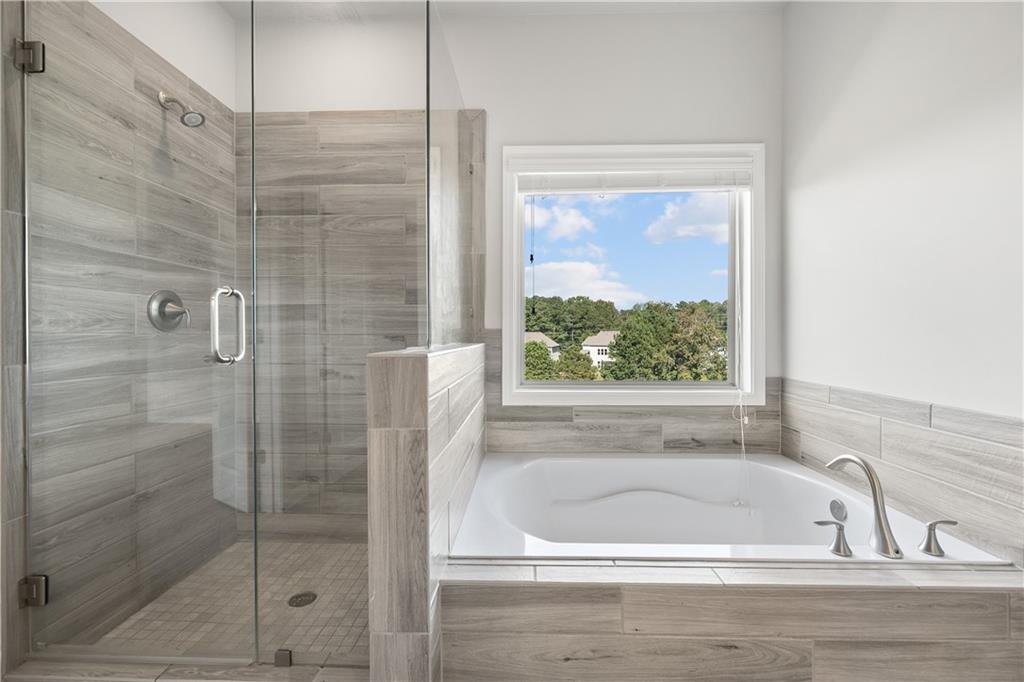 2375 Matlin Way Buford, GA 30519 - Photo 36 of 58 a bathroom with a bathtub