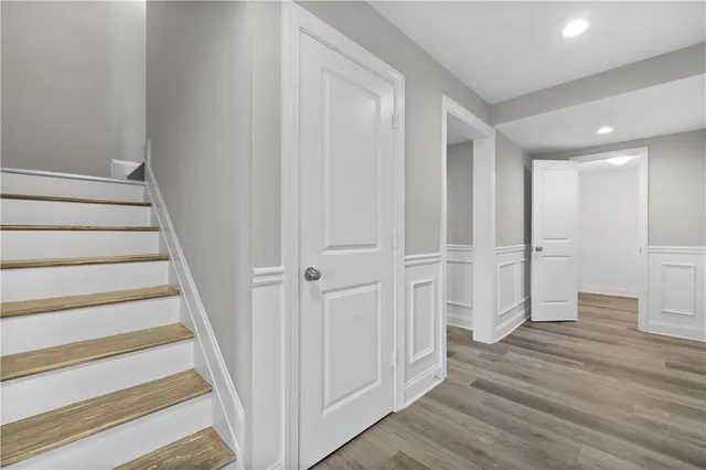 a view of wooden floor and windows in a room
