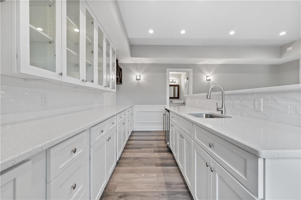 2375 Matlin Way Buford, GA 30519 - Photo 42 of 58 a kitchen with white cabinets