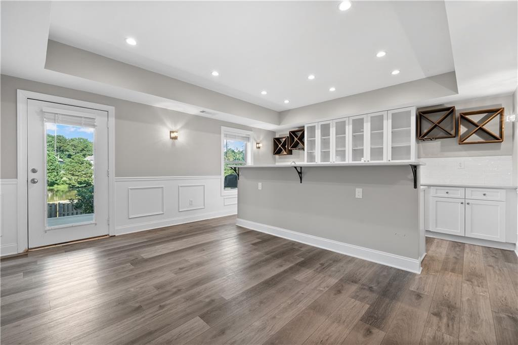 2375 Matlin Way Buford, GA 30519 - Photo 43 of 58 an empty room with wooden floor and windows