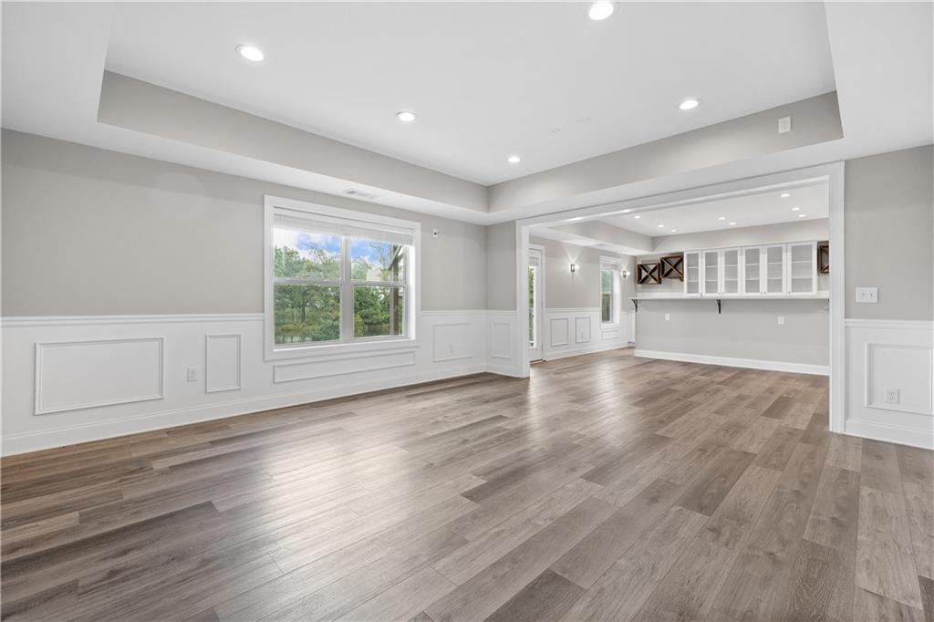 2375 Matlin Way Buford, GA 30519 - Photo 46 of 58 a view of an empty room with wooden floor and a window