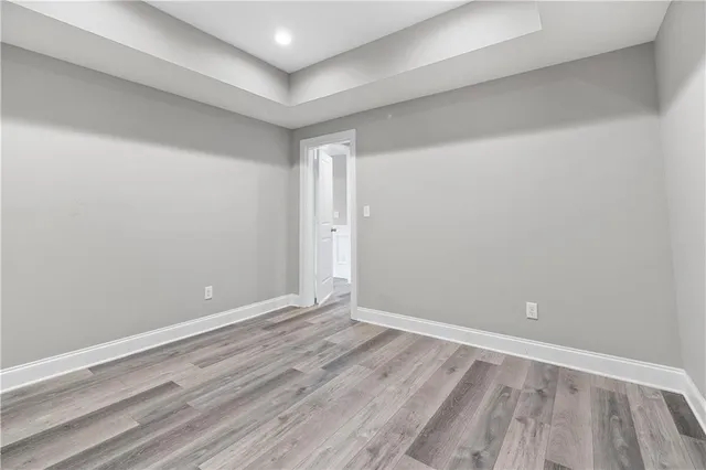 an aerial view of a house with a yard and lake view