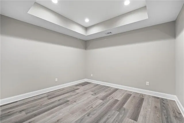 an aerial view of a residential houses with yard