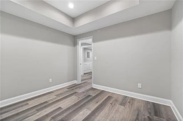 a view of a swimming pool with a patio and a yard