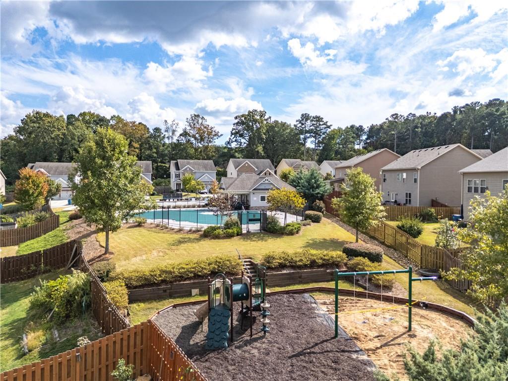 2375 Matlin Way Buford, GA 30519 - Photo 57 of 58 a view of a swimming pool with a patio and a yard