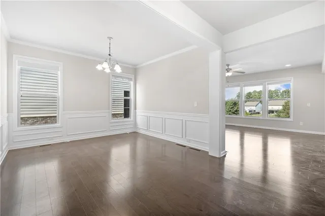a view of an entryway with wooden floor