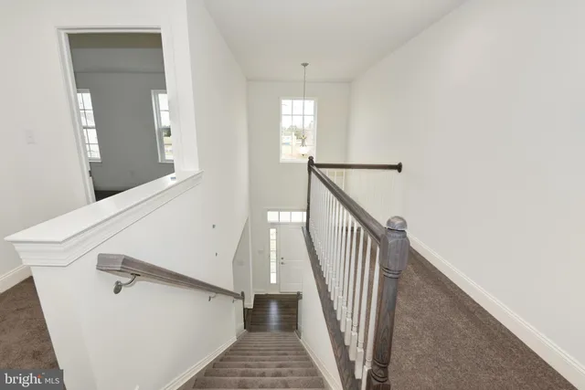 a view of a hallway with staircase