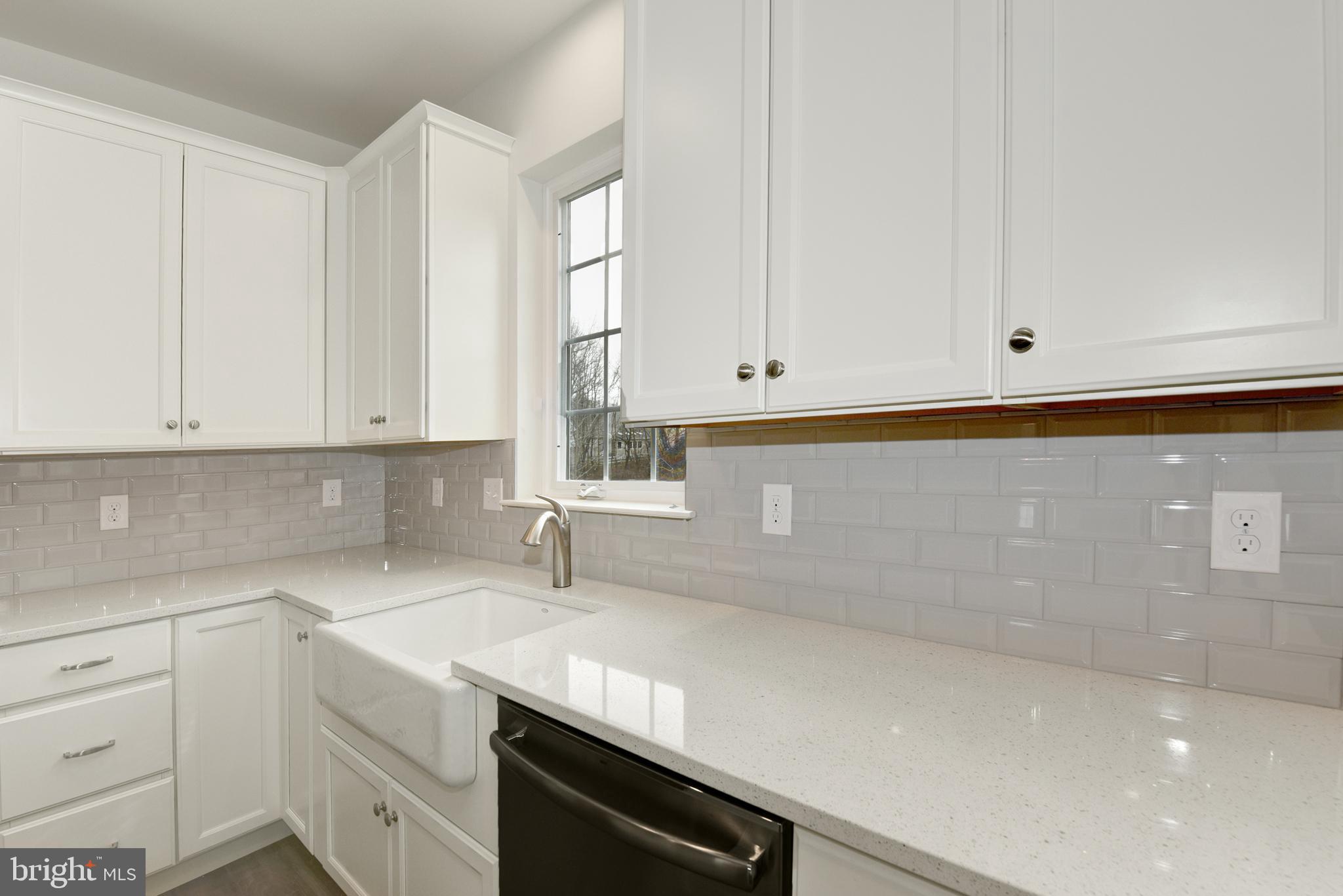 400 Rederick Lane, Unit 2 Middletown, DE 19709 - Photo 8 of 23 a kitchen with granite countertop white cabinets and a sink