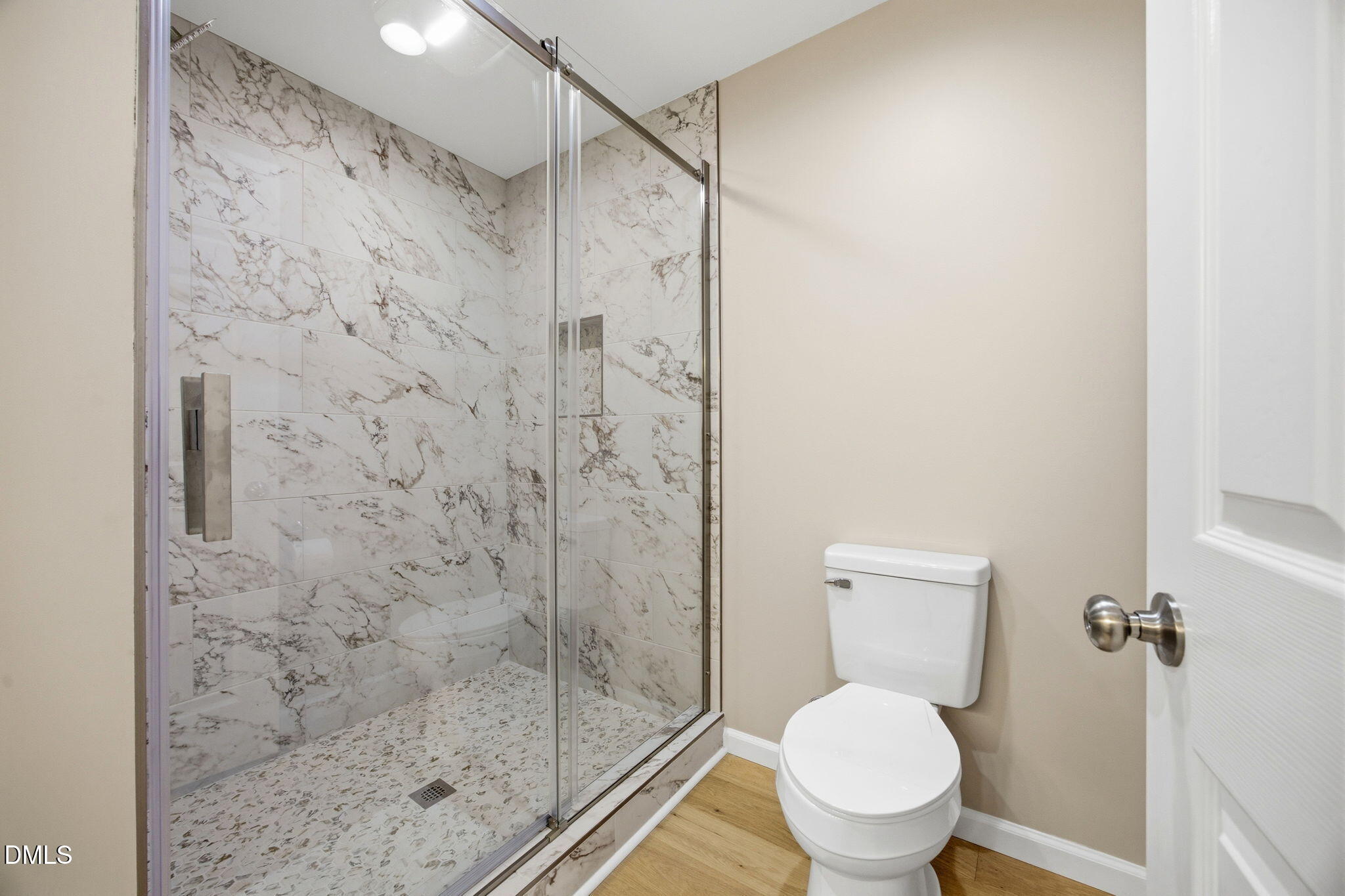 4105 Culbreth Road Stem, NC 27581 - Photo 12 of 41 a white toilet sitting next to a shower